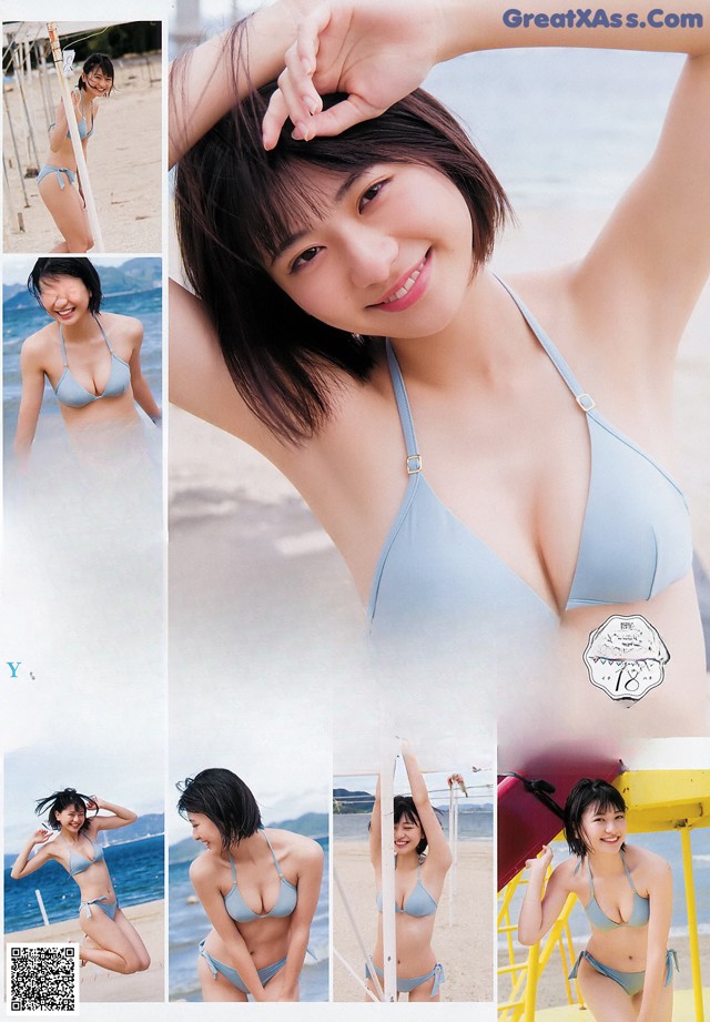 A woman in a blue bikini posing on a beach.
